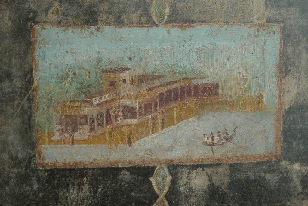V.4.a Pompeii. July 2010. East panel of north wall of tablinum with wall painting of villa and waterfront scene. Photo courtesy of Michael Binns.