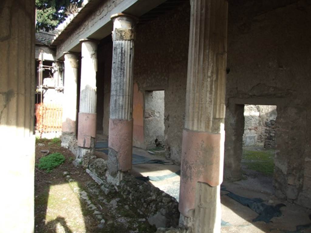 VI.1.7 Pompeii. December 2007. East side of room 13, the Peristyle.
According to Jashemski, the peristyle garden was enclosed on all four sides by a portico. It was supported on the west, east and south by twelve stuccoed columns, smooth below and fluted above. In the middle of the garden were two large adjacent pools, the interiors of both were painted blue. The south pool was rectangular in shape and had steps leading into it on the east side. The north pool which is square had much of its space occupied by a massive masonry square, which probably supported a large fountain statue. See Jashemski, W. F., 1993. The Gardens of Pompeii, Volume II: Appendices. New York: Caratzas. (p.119)

