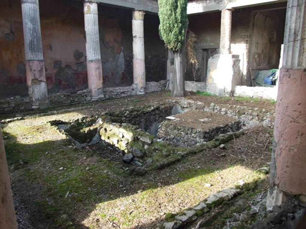 VI.1.7 House of the Vestals.  Looking north west across pool in room 13, the peristyle.