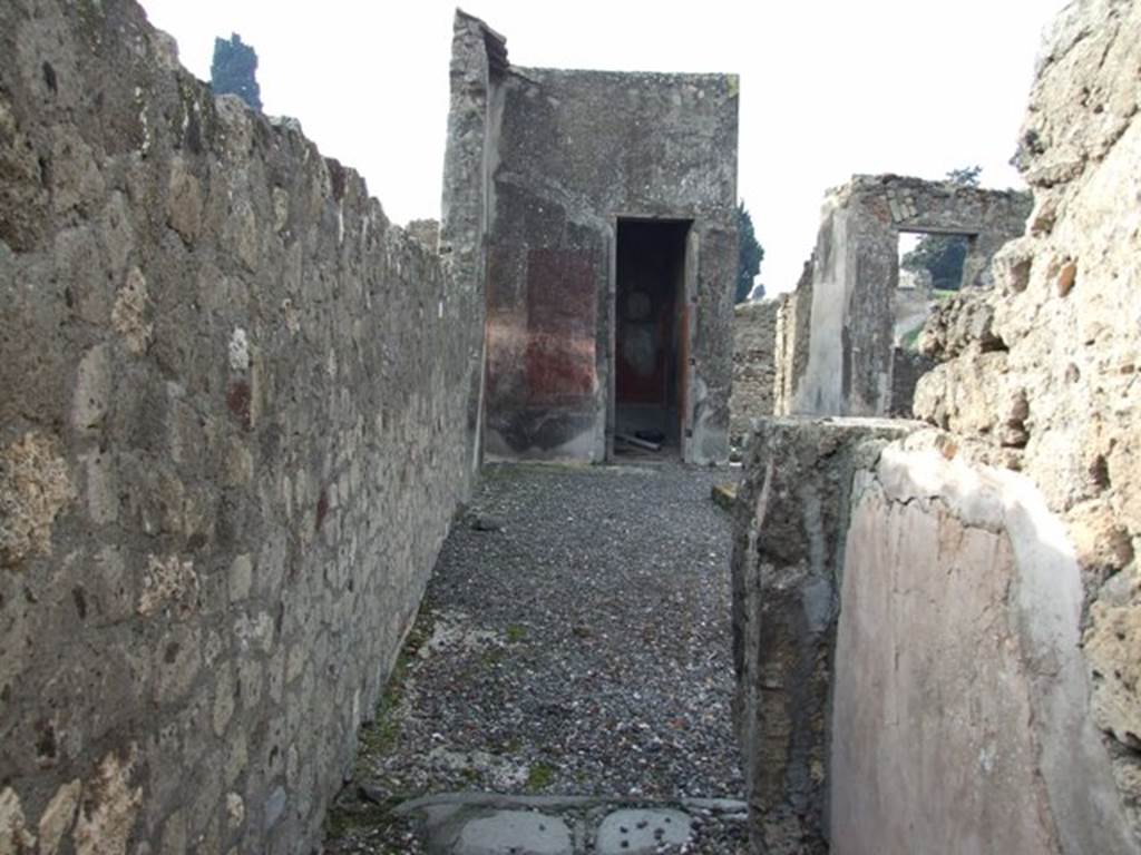 VI.5.3 Pompeii.  December 2007. Looking west from the corridor of room 7 across the south side of atrium to doorway to room 20.  According to Breton, on the left would have been the wall with the painting of Neptune.  According to Helbig, the atrium also contained a painting – the chariot of Artemis (246) as well as one of Poseidon or Neptune. (172)
See Breton, Ernest. 1870. Pompeia, Guide de visite a Pompei, 3rd ed. Paris, Guerin.  See Helbig, W., 1868. Wandgemälde der vom Vesuv verschütteten Städte Campaniens. Leipzig: Breitkopf und Härtel. (246, 172)  Schefold showed a black-and-white photo of this wall in Taf.101 of the book below. See Schefold, K., 1962. Vergessenes Pompeji. Bern: Francke.(p.122 and Taf.101)
