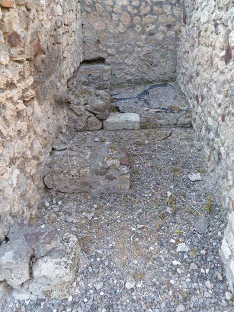 VI.5.8 Pompeii. May 2011. Looking north into kitchen, with latrine at the far end.