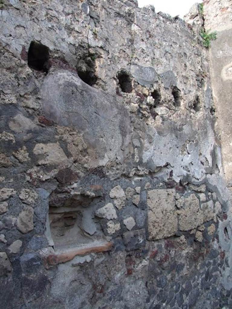 VI.7.5 Pompeii. March 2009. Lararium niche in north wall. According to Boyce, in the north wall was a trapezoidal niche called by Fiorelli la nicchia dei Penati. See Boyce G. K., 1937. Corpus of the Lararia of Pompeii. Rome: MAAR 14. (p.47, no.161) 
