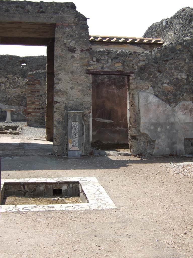 VI.7.23 Pompeii. May 2006.
North-west corner of atrium, and doorway to tablinum, on left, and to a cubiculum, on right.
