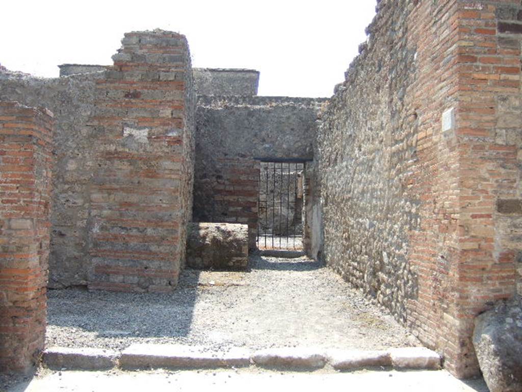 VI.8.13 Pompeii. May 2006. Entrance doorway, looking west to doorway into VI.8.9.