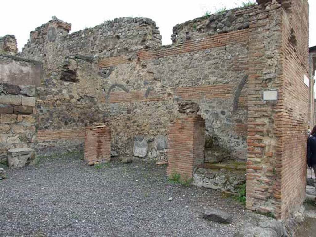 VI.10.15 Pompeii. May 2010. East wall with steps to upper floor, with base of two brick steps.