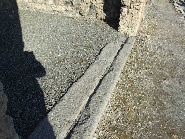VI.14.14. Sill at front of shop with groove for wooden shutters.