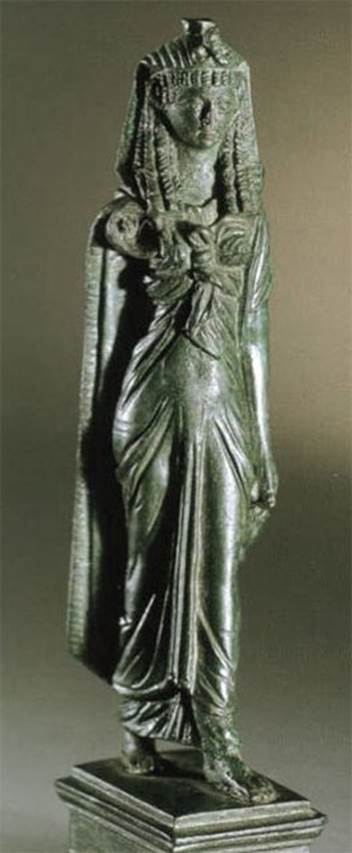 VI.14.27 Pompeii. Found in room b. 
Bronze statuette of Isis.  
Now in Naples Archaeological Museum. Inventory number 110605?


