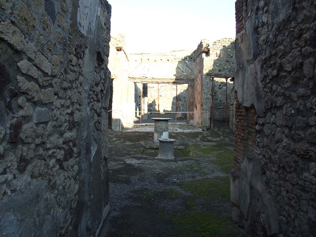 VI.14.40 Pompeii. December 2007. Looking east from fauces or entrance corridor, across atrium to tablinum.  
According to Garcia y Garcia, this house also had two rooms hit by the 1943 bombardment, with the loss of IV style painting.
See Garcia y Garcia, L., 2006. Danni di guerra a Pompei. Rome: L’Erma di Bretschneider. (p.93, with two photos by Tatiana Warscher pre 1943 on p.94).

