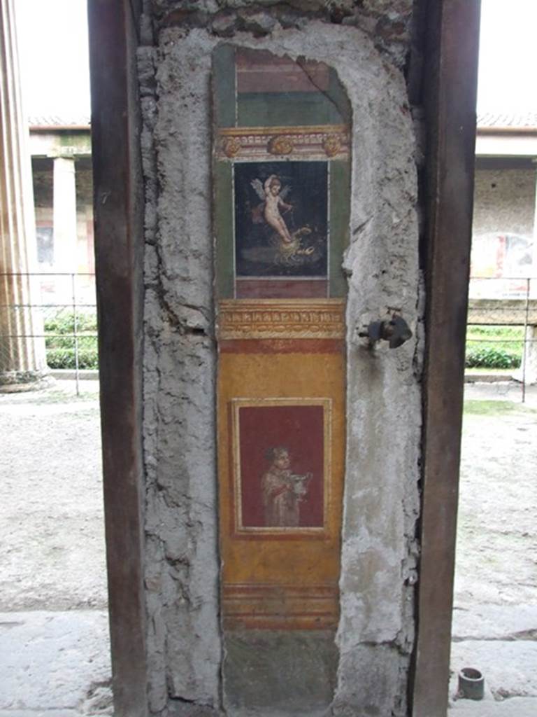 VI.15.1 Pompeii. December 2006.  Detail of painted pillar between Peristyle and Atrium.
