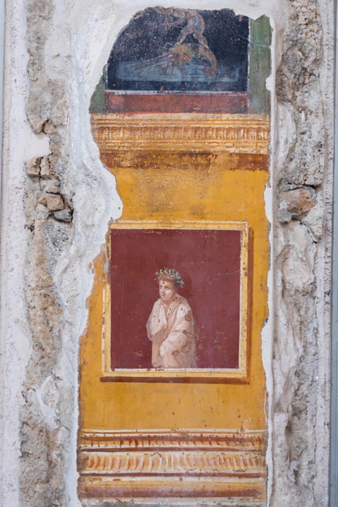 VI.15.1 Pompeii. March 2023. 
Painted panel on north end of west wall of atrium, leading onto peristyle. Photo courtesy of Johannes Eber.
