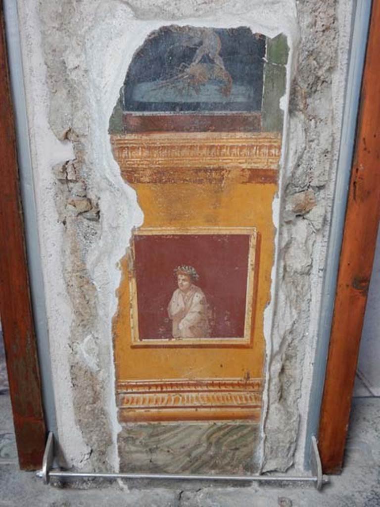 VI.15.1 Pompeii. May 2017. 
Painted panel on north end of lower west wall of atrium, leading onto peristyle. Photo courtesy of Buzz Ferebee.

