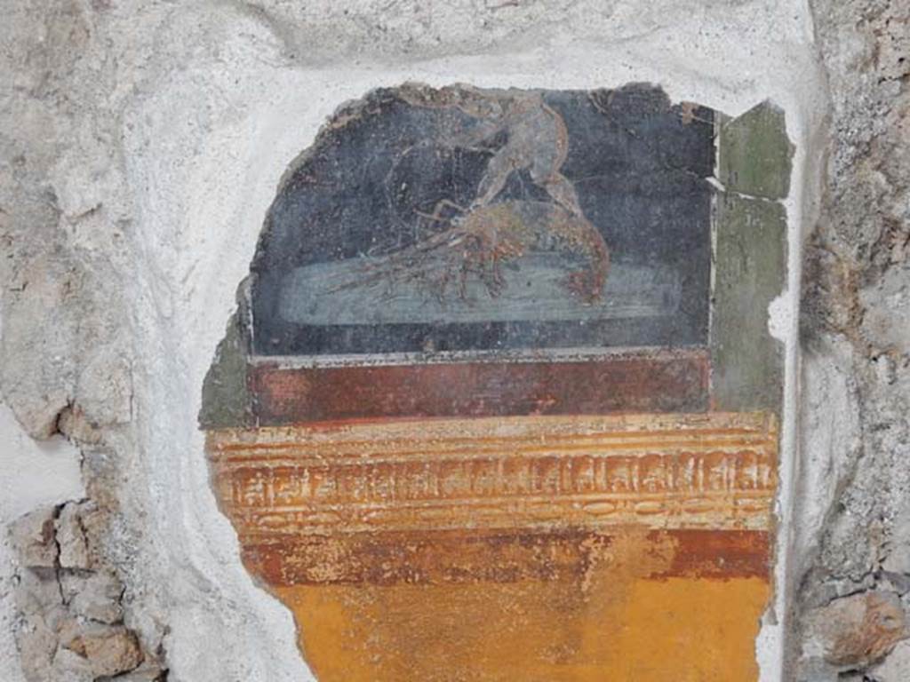VI.15.1 Pompeii. May 2017. 
Detail from painted panel on north end of west wall of atrium, leading onto peristyle. Photo courtesy of Buzz Ferebee.


