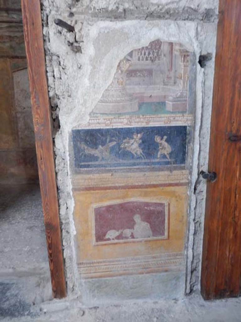 VI.15.1 Pompeii. May 2017. 
Painted panels in atrium between doorways to bedroom on left of main entrance and oecus on south side.
Photo courtesy of Buzz Ferebee.

