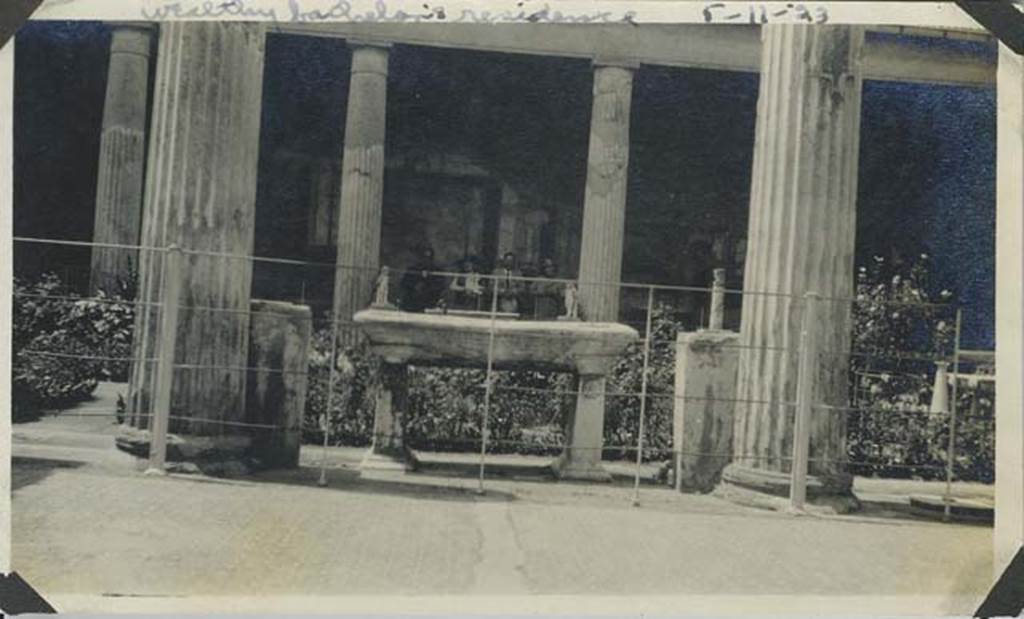 VI.15.1 Pompeii. May 1923 photograph. Looking west across peristyle from east portico.
Photo courtesy of Rick Bauer.
