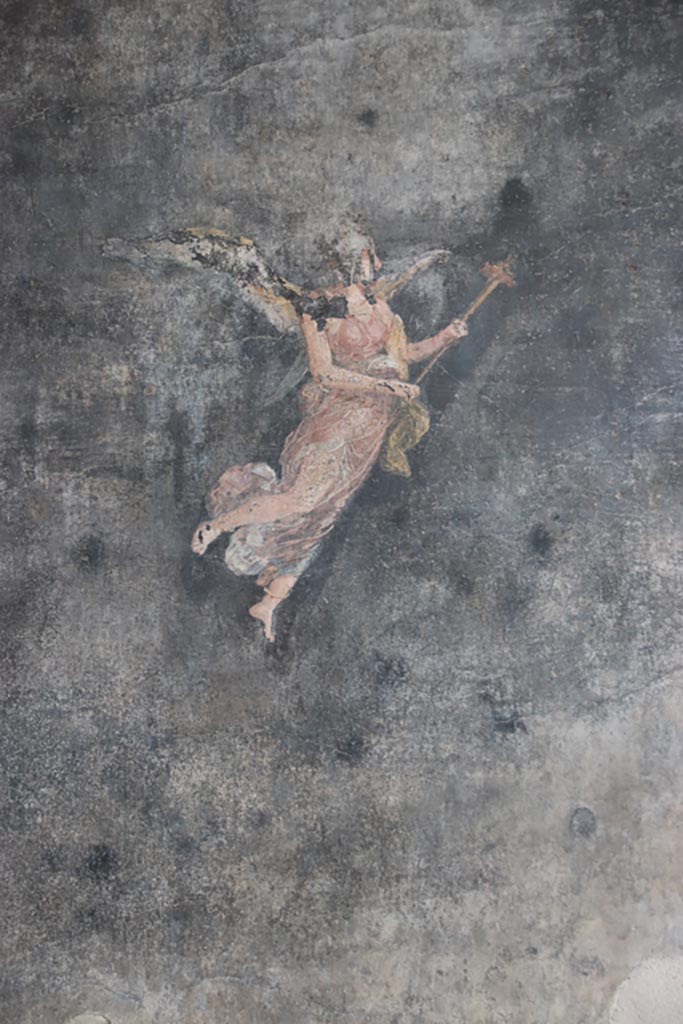 VI.15.1 Pompeii. October 2023. 
Painted figure from centre of panel on south wall of peristyle. Photo courtesy of Klaus Heese.
