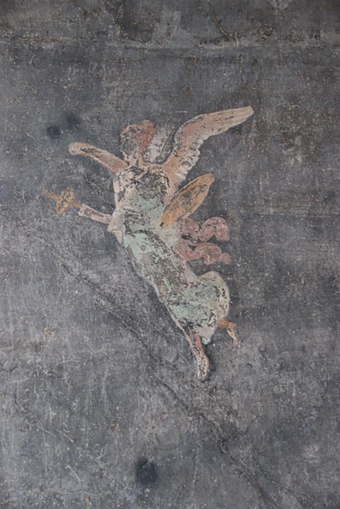 VI.15.1 Pompeii. October 2023. 
Painted figure on south wall near south-west corner of peristyle. Photo courtesy of Klaus Heese.
