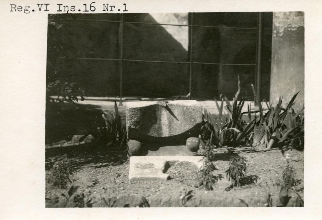 VI.16.7 Pompeii, but shown as VI.16.1 on photo. Pre-1937-39. 
Looking towards sundial in peristyle garden near north portico.
Photo courtesy of American Academy in Rome, Photographic Archive. Warsher collection no. 498.
According to Powers (ed) –
“This sundial was found in 1904 and was made from marble and bronze. 
The bronze gnomon cast a shadow on the instrument’s concave upper surface, which is marked with radiating lines to indicate the hours of the day. Vine tendrils in relief decorate its sides, and the lost front corners probably took the form of a pair of feline paws.”
See Powers, J. (ed). 2023. Roman Landscapes, Visions of Nature and Myth from Roman Pompeii. USA,San Antonio Museum of Art, (p.129, no.27).


