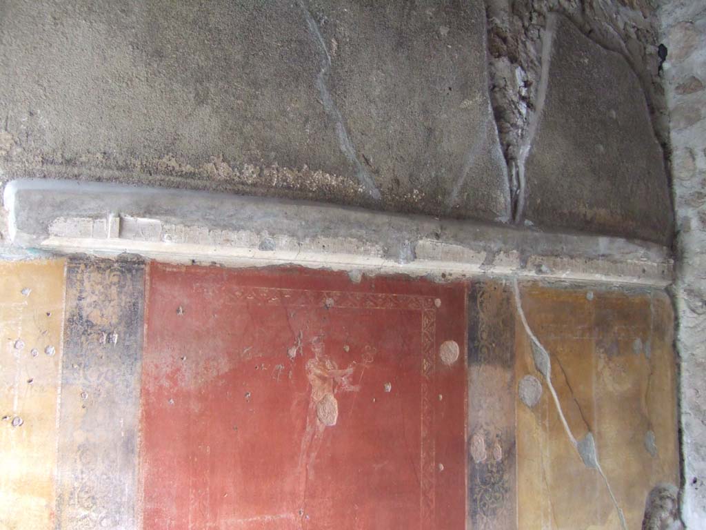 VI.16.7 Pompeii. May 2006. Room D, red and yellow zones with paintings of floating figures on north wall.