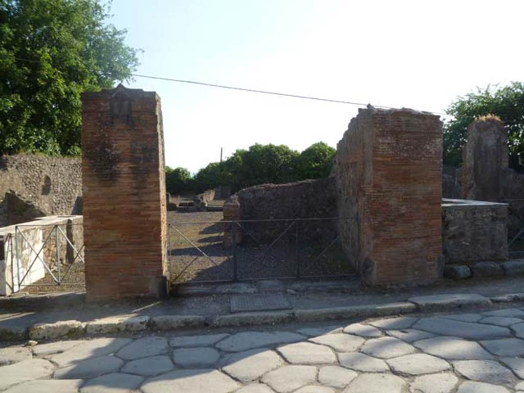 VI.17.3 Pompeii. May 2011. Looking west from Via Consolare towards entrance doorway, in centre.