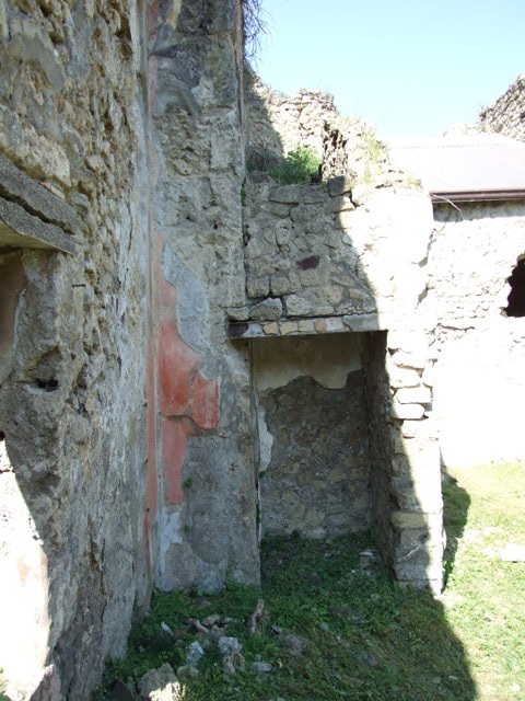 VII.3.29 Pompeii.  March 2009.  Room 1. Remains of wall plaster in north west corner of Atrium.