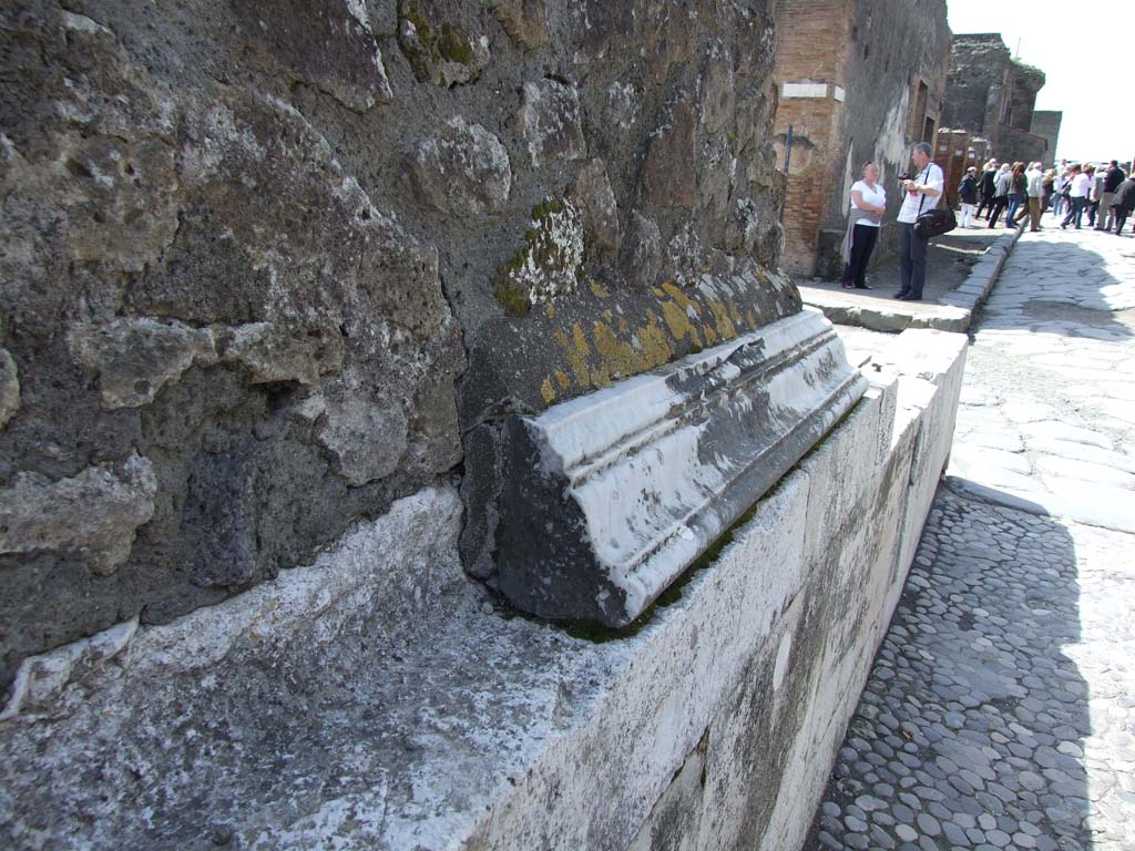 VII.4.1 Pompeii. March 2009. Marble cornice on north wall above pavement on Via della Fortuna. Looking west.
According to Niccolini in 1854, the pavement was unique in that it came from the ancient works of crushed and well-polished gravel
See Niccolini F, 1854. Le case ed i monumenti di Pompei: Volume Primo. Napoli, Tempio della Fortuna, Tav. I, n. 13, p. 4.
