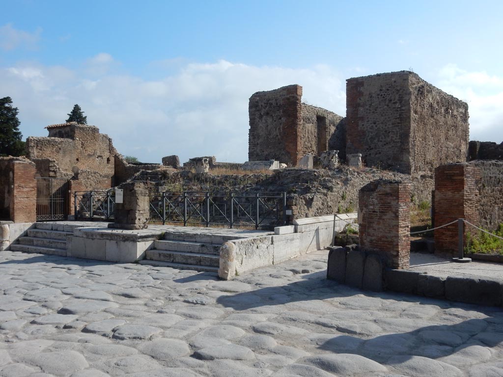 VII.4.1 Pompeii, on left, with VII.4.2, in centre. May 2017. Looking north-east on Via del Foro. Photo courtesy of Buzz Ferebee.