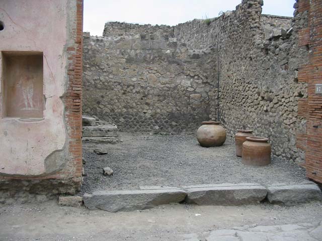 VII.4.17 Pompeii.  May 2010. Street shrine with a picture of Jupiter on left pillar of VII.4.17. See Fr�hlich, T., 1991, Lararien und Fassadenbilder in den Vesuvst�dten.  Mainz: von Zabern.  (F48: p.325). See Eschebach, L., 1993, Geb�udeverzeichnis und Stadtplan der antiken Stadt Pompeji.  K�ln: B�hlau.  (p.275).
