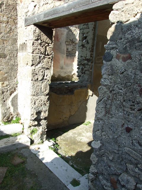 VII.4.31 Pompeii.  March 2009.  Room 11. Corridor to steps to Peristyle, and small doorway to Room 12. Oecus.