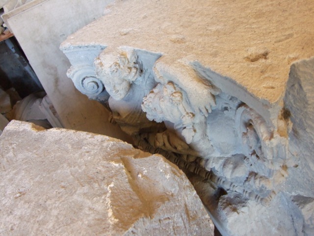 VII.4.57 House of the Figured Capitals.  Satyr (background) pursuing a maenad on a capital.  This faced the street on the top of left hand side of entrance.