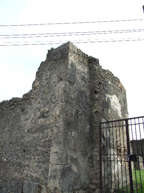 VII.4.57 House of the Figured Capitals.  Satyr (background) pursuing a maenad on a capital.  This faced the street on the top of left hand side of entrance.