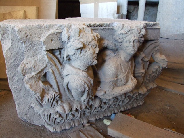 VII.4.57 House of the Figured Capitals.   Figures of a man and woman on a capital.  This faced in to the vestibule on the top of left hand side of entrance.