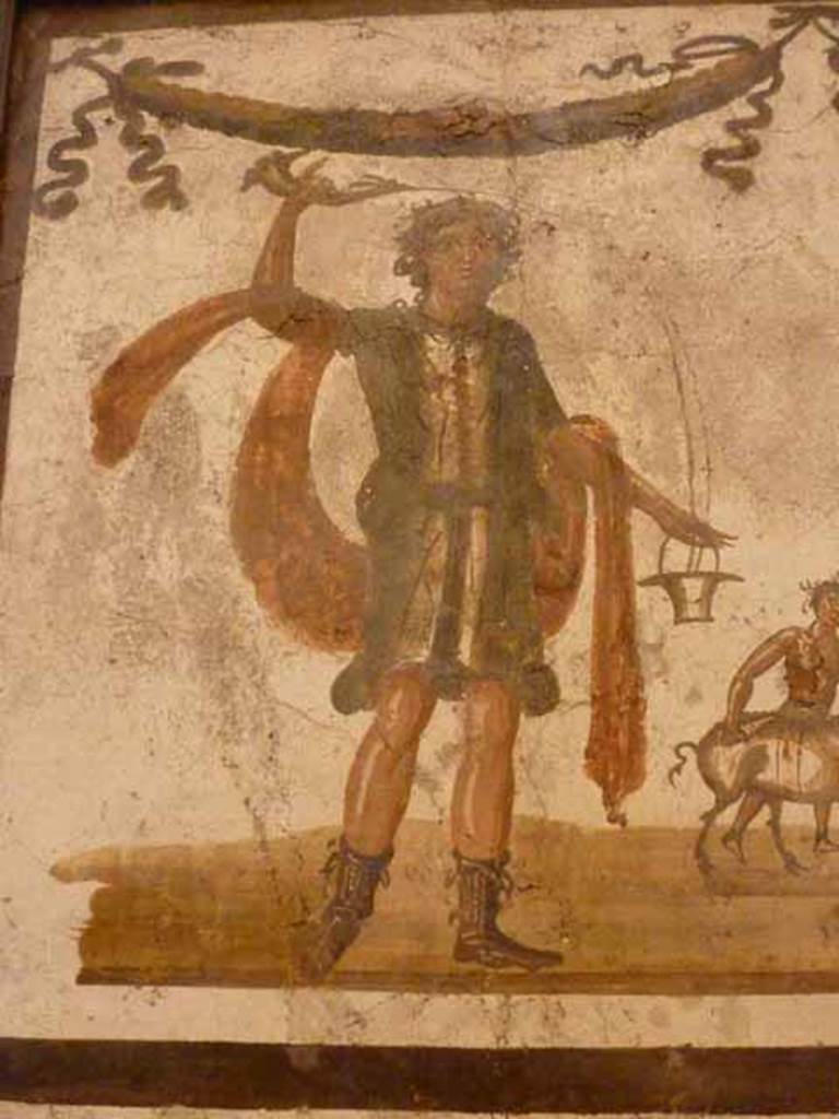 VII.6.38 Pompeii. Detail of Lar, on left side of lararium painting. Now in Naples Archaeological Museum. Inventory number: 8905.
