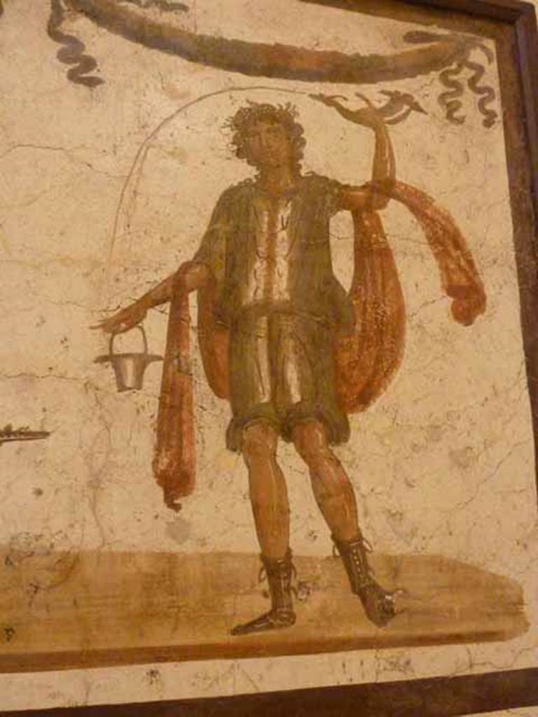 VII.6.38 Pompeii. Detail of Lar, on right side of lararium painting. Now in Naples Archaeological Museum. Inventory number: 8905.
