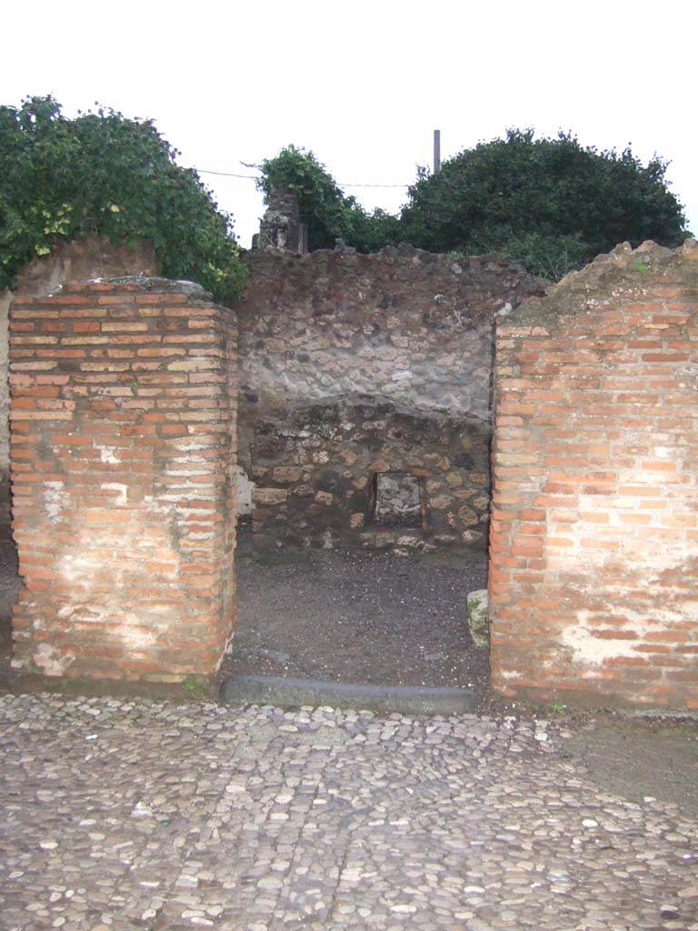 VII.7.8 Pompeii. December 2005. Looking north to entrance doorway, to steps to upper floor.