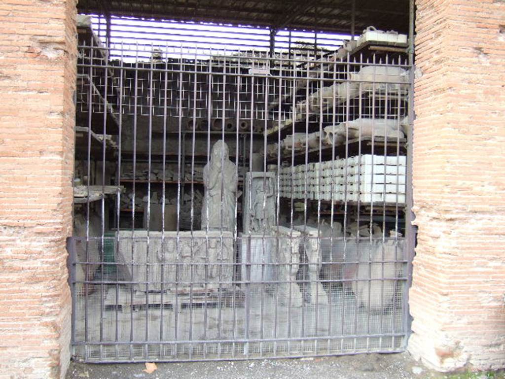VII.7.29 Pompeii. May 2006. Looking west through entrance doorway towards items in storage.