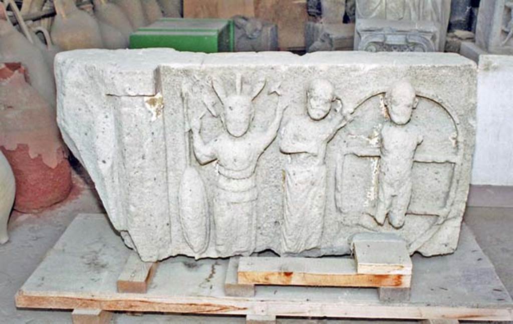 VII.7.29 Pompeii. October 2001. The only surviving metope (an architectural element from a frieze) from VIII.7.31 the Doric Temple, showing the punishment of Ixion on the wheel.  Now in storage in the VII.7.29 Forum Granary Store. Photo courtesy of Peter Woods.
See Dobbins, J. J. and Foss, P. W., 2008. The World of Pompeii. Oxford: Routledge. (p. 78).
