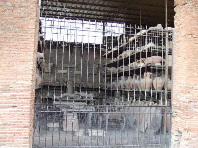 VII.7.29 Pompeii. August 2021. Looking west along north side towards items in storage. Photo courtesy of Robert Hanson.