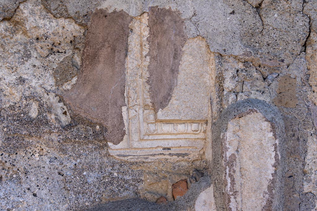 VII.7.32 Pompeii. October 2023. Detail of west end of north side of cella. Photo courtesy of Johannes Eber.