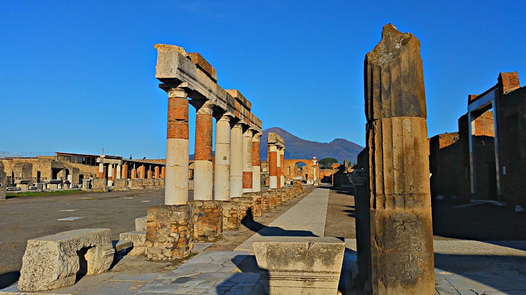 VII.8 Pompeii Forum. 2017/2018/2019. Looking north along east side from portico of Eumachia. Photo courtesy of Giuseppe Ciaramella.