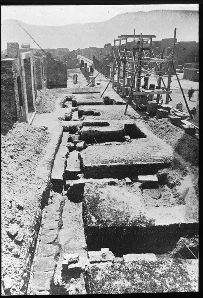 VII.8 Pompeii Forum, east side. Samnite shops.
Looking south along the east side during excavations, with entrance doorway to Eumachia’s Building, on left.
This photo was captioned as VII.8 Forum east side, Samnite shops.
Photo by permission of the Institute of Archaeology, University of Oxford. File name instarchbx208im 068. Source ID. 44394.
See photo on University of Oxford HEIR database
See Notizie degli Scavi, 1941, (p.371-386) where this photo is entitled –
 “An overview of the shops brought to light in the area outside of Eumachia’s Building, the portico or chalcidicum”, on p.372.
See Notizie degli Scavi, 1941, (p.386-404) for excavations in the Piazza of the Forum.
