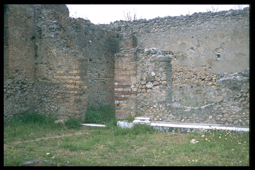 VII.9.1 Pompeii. North-west corner of colonnade 9, with remains of marble veneer.
Photographed 1970-79 by Günther Einhorn, picture courtesy of his son Ralf Einhorn.
