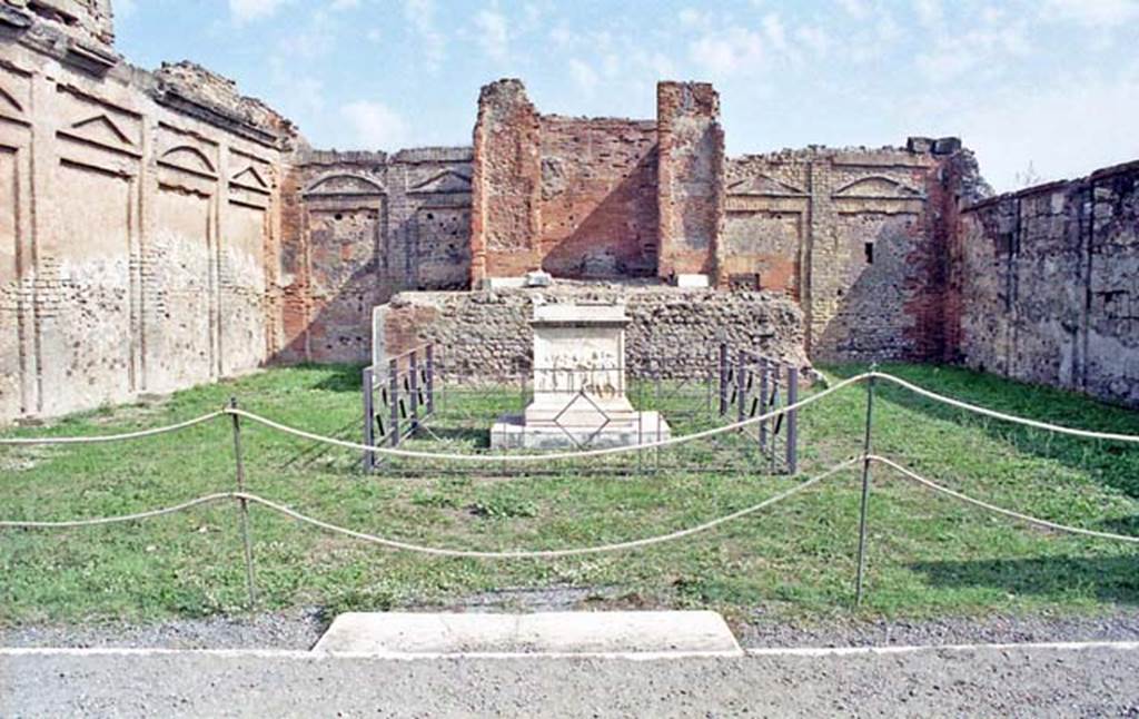 VII.9.2 Pompeii. October 2001. Looking towards east wall with cella and podium, and altar, in centre. Photo courtesy of Peter Woods.
