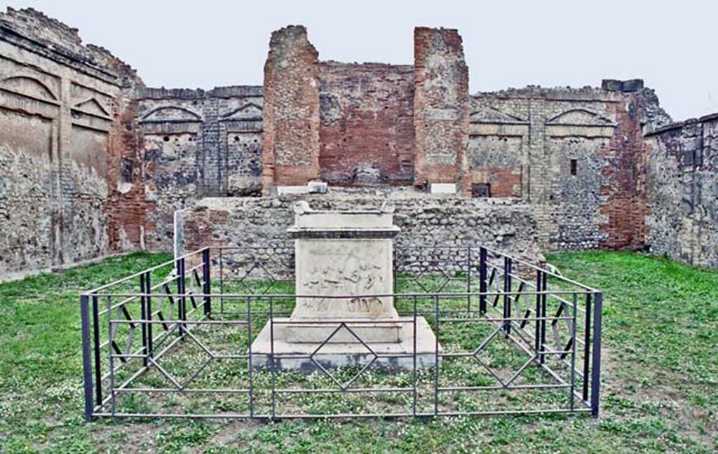 VII.9.2 Pompeii. October 2001. Looking towards east wall with cella and podium, and altar, in centre. Photo courtesy of Peter Woods.
