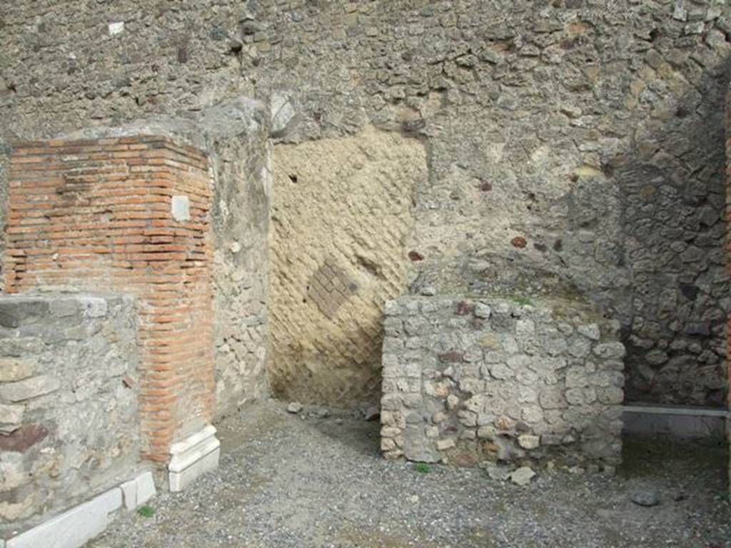 VII.9.4 Pompeii. December 2007. North wall with remains of marble surround on left.