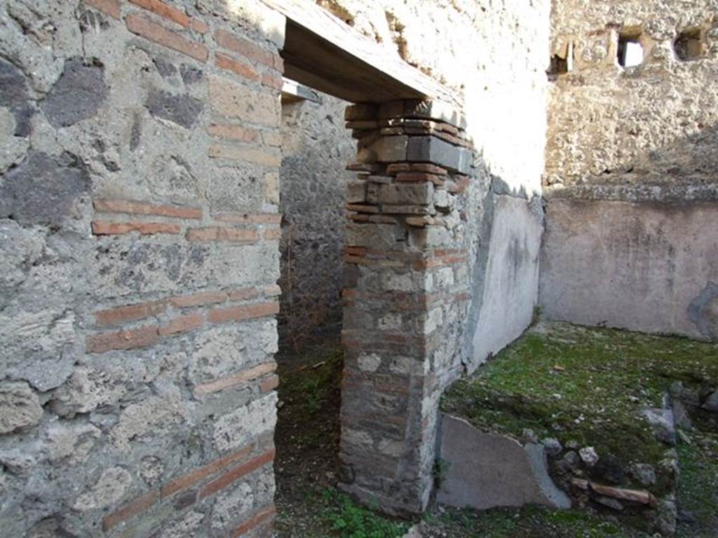 VII.11.5 Pompeii. December 2007. North wall with door to corridor and latrine.