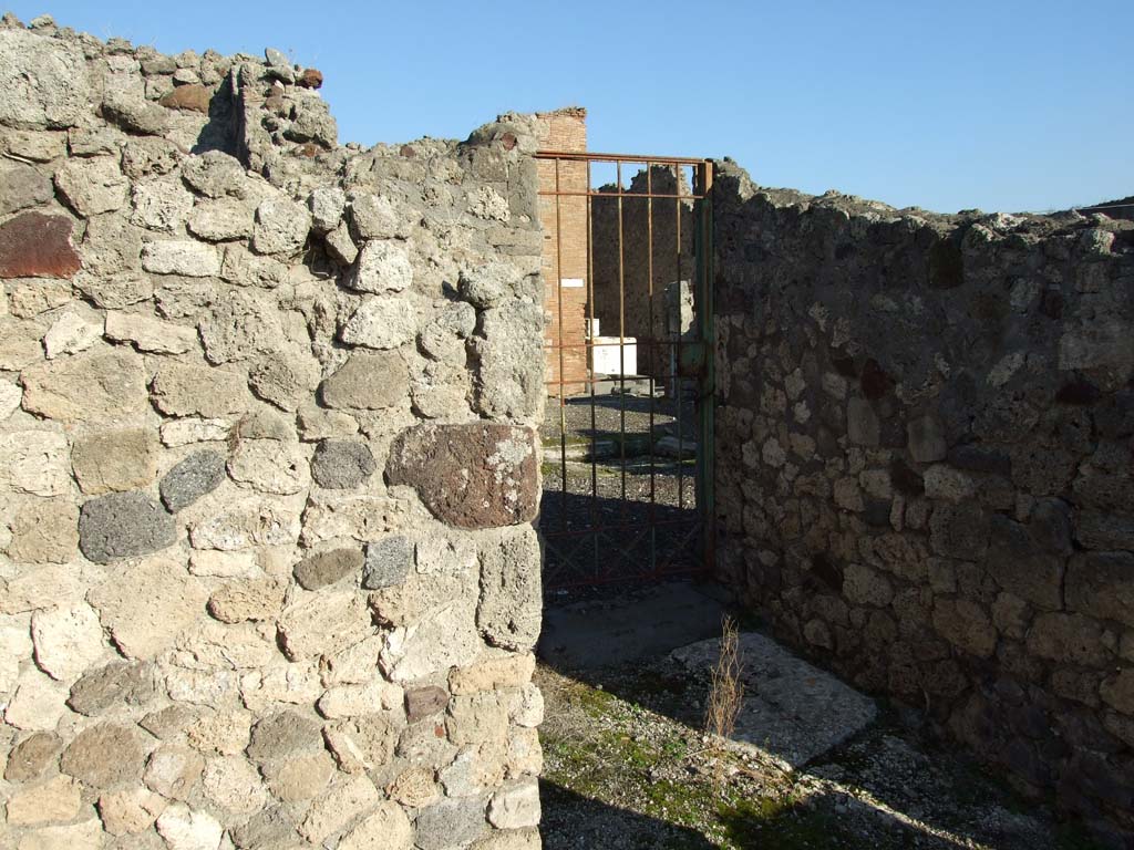 VII.16.13 Pompeii. December 2007. Area 27, looking east through gate into VII.16.12.