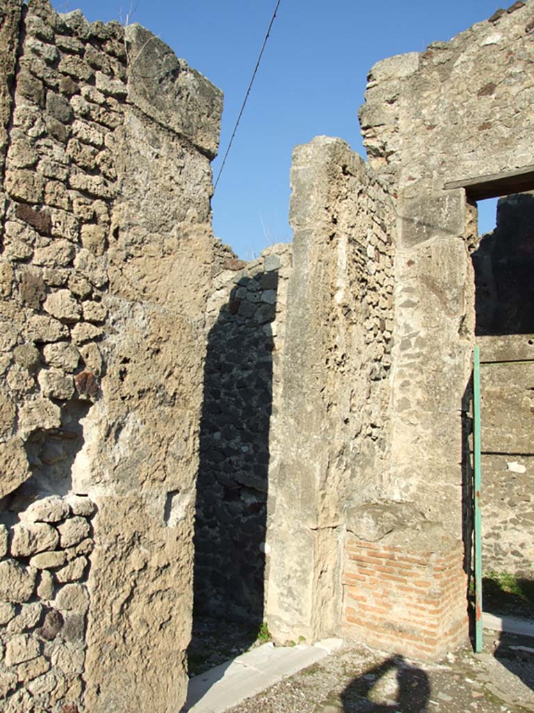 VII.16.13 Pompeii. December 2007. Doorway to room 5 on the north-east side of atrium, on the left.
According to Mau, there was an alcove for a bed opposite the doorway. 
The ceiling of the alcove, in the form of a vault, was lower than that of the rest of the room.
See Mau, A., 1907, translated by Kelsey F. W. Pompeii: Its Life and Art. New York: Macmillan. (p. 300).
