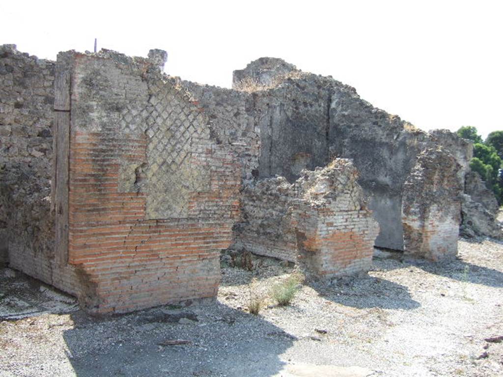 VII.16.15 Pompeii. September 2005. Doorways to rooms 12, 11, 10 and 9 on south side of atrium