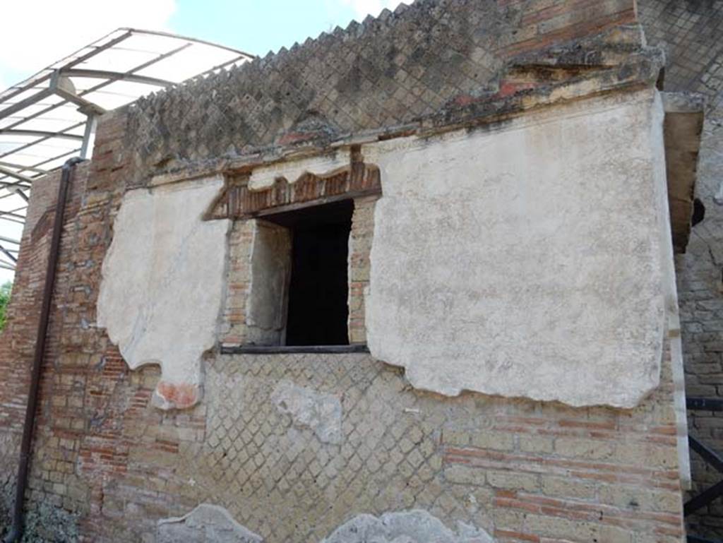 VII.16.a Pompeii. September 2005. Doorway to room 1 and windows of room 4, on east side of courtyard C.
