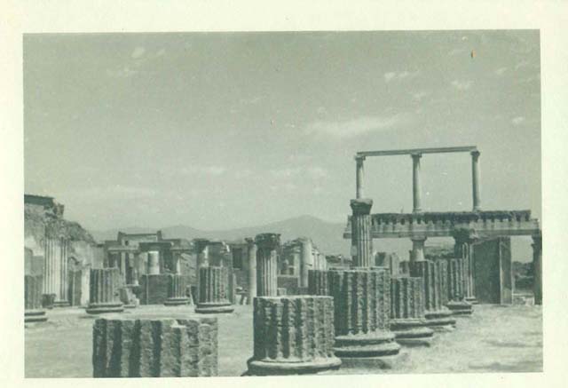 VIII.1.1 Pompeii. Image taken in 1955 by an officer serving aboard the HMS Ark Royal. Looking east along south side towards Forum. Photo courtesy of Rick Bauer.
